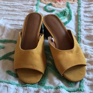 Mustard yellow slip-ons.